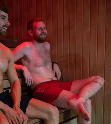 two people relaxing in a sauna 